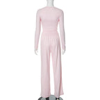 Completo donna dettaglio pantaloni pieghe vita alta