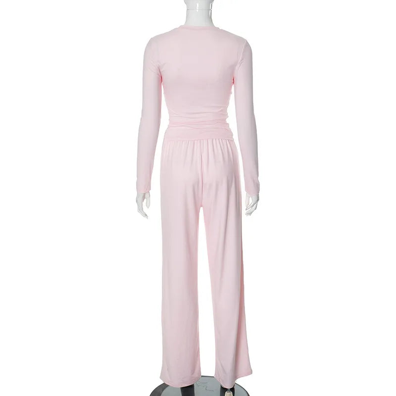 Completo donna dettaglio pantaloni pieghe vita alta