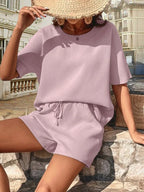 Completo donna manica pipistrello lilla - vista frontale con fiocco e pantaloncini drawstring